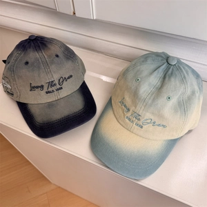 Two gradient embroidered baseball caps with wide brims for a face-slimming effect