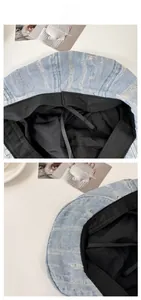 Détail d'un béret en jean bleu clair avec bords effilochés ondulés et doublure ajustable