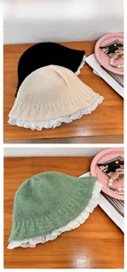 Close-up of knit bucket hat featuring delicate white lace trim and vintage knit texture