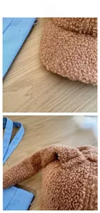 Close-up detail of plush brown lamb wool texture with curly fleece on a baseball cap