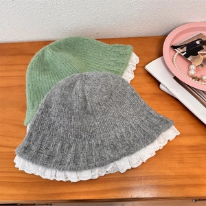 Lace trim knitted bucket hats in sage green and grey with soft wool textures