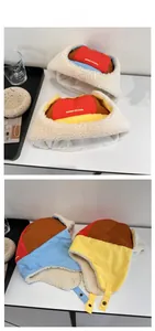 Detailed view of color-block trapper hat featuring thick fleece lining and ear flaps