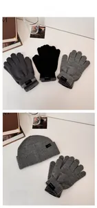 Matching knit beanie and touchscreen gloves set in classic grey and black colors