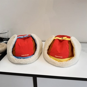 Winter padded earflap aviator hats in vibrant colorblock with white faux lamb wool lining