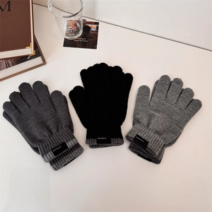 Winter knitted touchscreen gloves in black and grey, ribbed cuffs with minimalist labels