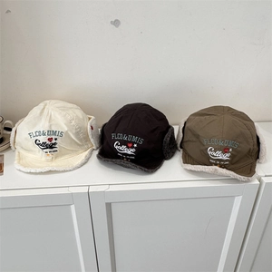 Winter trapper hats with earflaps in cream, black and green with fleece lining