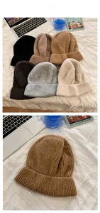 Close-up of thick rib-knitted beanies in multiple colors on a cozy home background