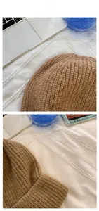 Close-up of thick ribbed knit brown beanie featuring warm camel wool texture