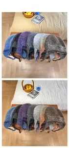 Detail display of textured wool blend knit beanies with earflaps in multiple colors