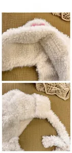 Macro shot of fluffy cream faux fur material and soft texture of a winter earflap hat