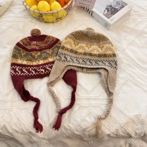 Retro colorful jacquard knit earflap hat with long braids and soft pom-poms for winter