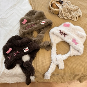 Plush bear ear hat with bow tie in brown and cream colors for winter warmth and comfort
