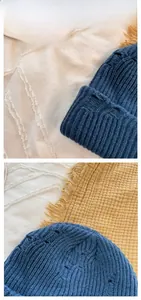 Detail view of navy blue ribbed knit beanie showing high-density texture and stitching