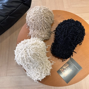 Chic plush baseball caps with tassels for women in black, camel, and beige winter styles