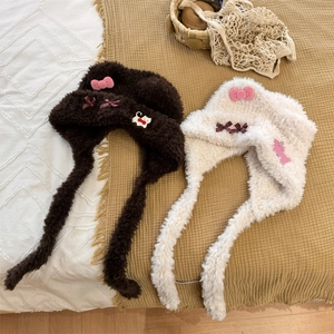 Cute bear-ear plush trapper hat with pink bows and cat patches for winter warmth