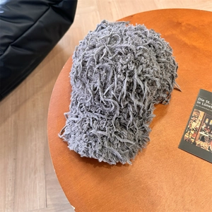 Chic grey faux fur baseball cap with plush tassel texture and fuzzy streetwear design