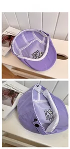 Close-up of purple cotton canvas hat interior featuring custom puppy embroidery and sweatband