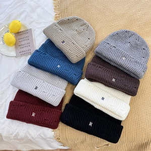 Distressed knit beanies with R-letter embroidery in eight vibrant assorted colors