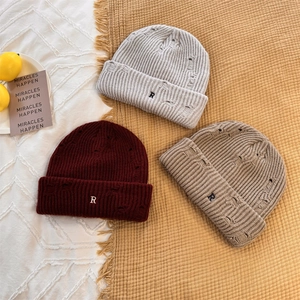 Distressed knit beanie with R letter embroidery in gray, burgundy, and khaki colors