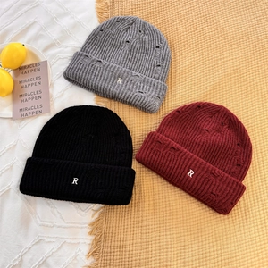 Stylish knitted beanie with distressed R letter embroidery in grey, black and burgundy