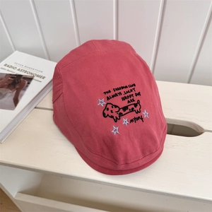 Street style red beret hat featuring detailed puppy embroidery and English text typography
