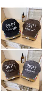 Detailed view of distressed baseball caps with paint splatter and vintage torn effects