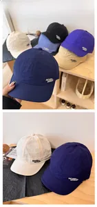 Detail of Never Give Up embroidery on lightweight quick-dry short brim baseball caps