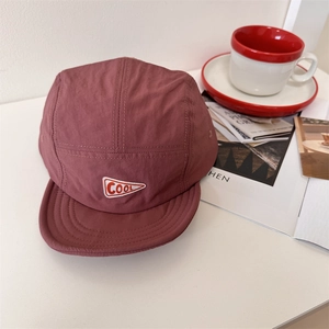 Brick red quick-dry five-panel camp cap with a triangular 'COOL' patch for casual wear