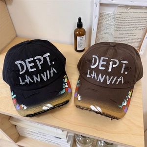 Distressed graffiti baseball cap with DEPT. LANVIA embroidery and ripped brim details