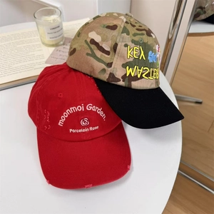 Washed cotton embroidered camouflage baseball cap with distressed brim and rose detail