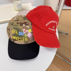 Camouflage and red distressed baseball caps with embroidery and wide brims for women