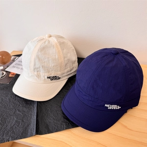 Minimalist short brim baseball caps in beige and navy blue with Never Give Up embroidery