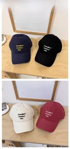 Four vintage baseball caps with Grandpa's Outdoor Hat embroidery in various colors