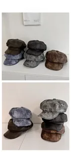 Flat lay showing vintage octagonal hats in various retro colors like brown and charcoal