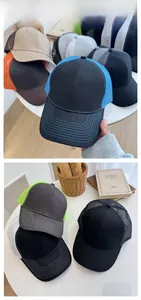 Close-up of contrast mesh baseball caps featuring five-row stitching on curved brims