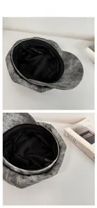 Detail view showing the vintage washed grey newsboy cap interior and side profile design