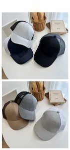 Close-up of summer mesh trucker caps in various colors on a rustic lifestyle display