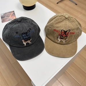Vintage washed cotton baseball cap featuring dog embroidery and flat brim design