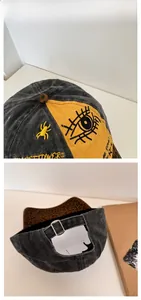 Detail of distressed baseball cap featuring yellow embroidery and leopard print brim