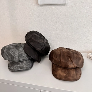 Three vintage PU leather newsboy caps in distressed grey, dark brown and rusty brown tones