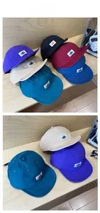 Collection of quick-dry camping hats with mountain logo patch in various outdoor colors