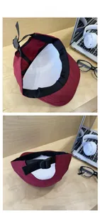 Detail of red quick-dry sports cap showing inner sweatband and adjustable buckle strap