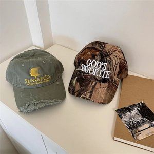 Distressed vintage baseball caps in olive green and jungle camo with custom embroidery