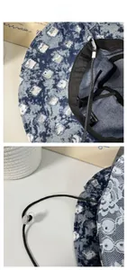 Détail d'un chapeau bob en jean avec bordure en dentelle, bandeau intérieur et cordon réglable