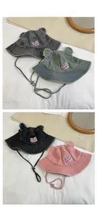 Detailed tile display of denim bucket hats with bear ears and adjustable windproof straps