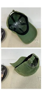 Detail of army green washed cotton baseball cap showing adjustable bronze metal buckle and interior