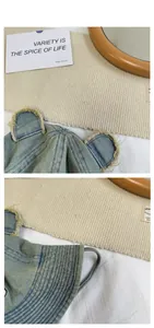 Detailed view of blue denim bucket hat with cute 3D bear ears and frayed edges