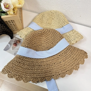 Summer straw sun hat with wavy brim and blue checkered bow ribbon in two colors
