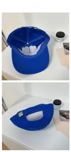 Detail view of royal blue baseball cap featuring interior lining and silver metal buckle