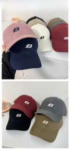 Detailed close-up of multi-color baseball caps with letter B 3D embroidery detail